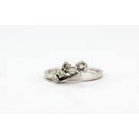 A 14ct white gold (stamped 585) ring set with brilliant cut diamonds, (K).