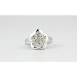 A 14ct white gold diamond set flower shaped cluster ring, (L.5).