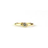A 9ct yellow gold stone set solitaire ring, (L).