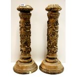 A pair of heavy stoneware candlesticks, H. 52cm.
