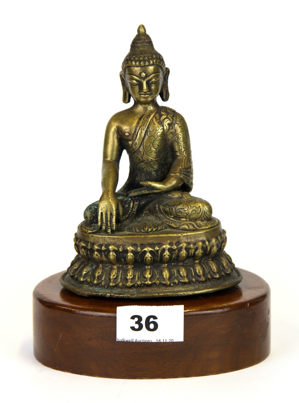 A wood mounted bronze figure of the Buddha, H. 20cm.