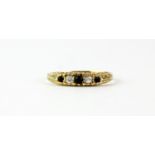 A 9ct yellow gold sapphire and white stone set ring, (O).