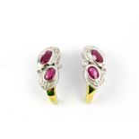 A pair of 9ct yellow and white gold ruby and diamond set earrings, L. 1.4cm.