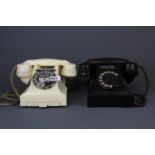 Two vintage Bakelite telephones.