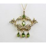 An Edwardian 9ct yellow gold (stamped 9ct) peridot and seed pearl set pendant and chain, L. 5 x 5.