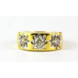 An 18ct yellow gold (stamped 750) gypsy ring set with three brilliant cut diamonds, approx. 1.72ct