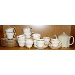 A extensive white and gilt Royal Vale tea set, with a Rosenthal teapot.