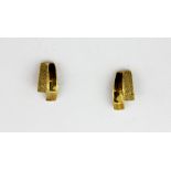 A pair of 9ct yellow gold stud earrings, L. 1.1cm.