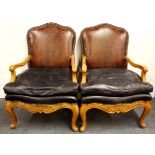 A pair of gentlemen's leather upholstered armchairs, W. 73cm H. 107cm.