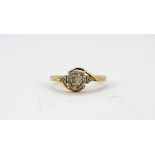 A 9ct yellow gold (stamped 9k) diamond set cluster ring with diamond set shoulders, (P).