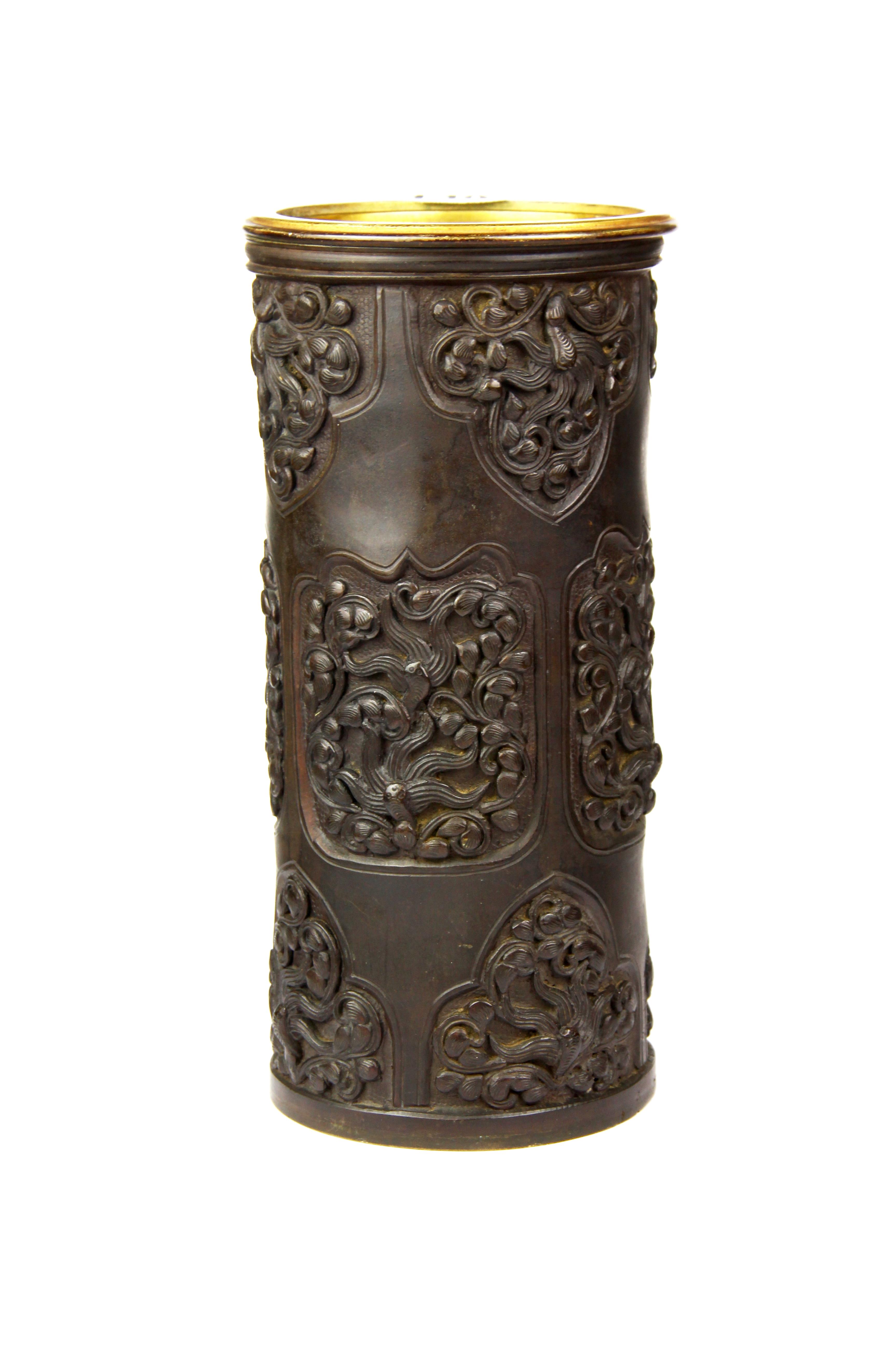 A 19th Century Japanese bronze cylinder vase/ brush pot with gilt brass insert, H. 24cm.