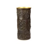 A 19th Century Japanese bronze cylinder vase/ brush pot with gilt brass insert, H. 24cm.