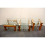 A set of three contemporary steel and plate glass coffee tables, 70 x 70 x 44cm.