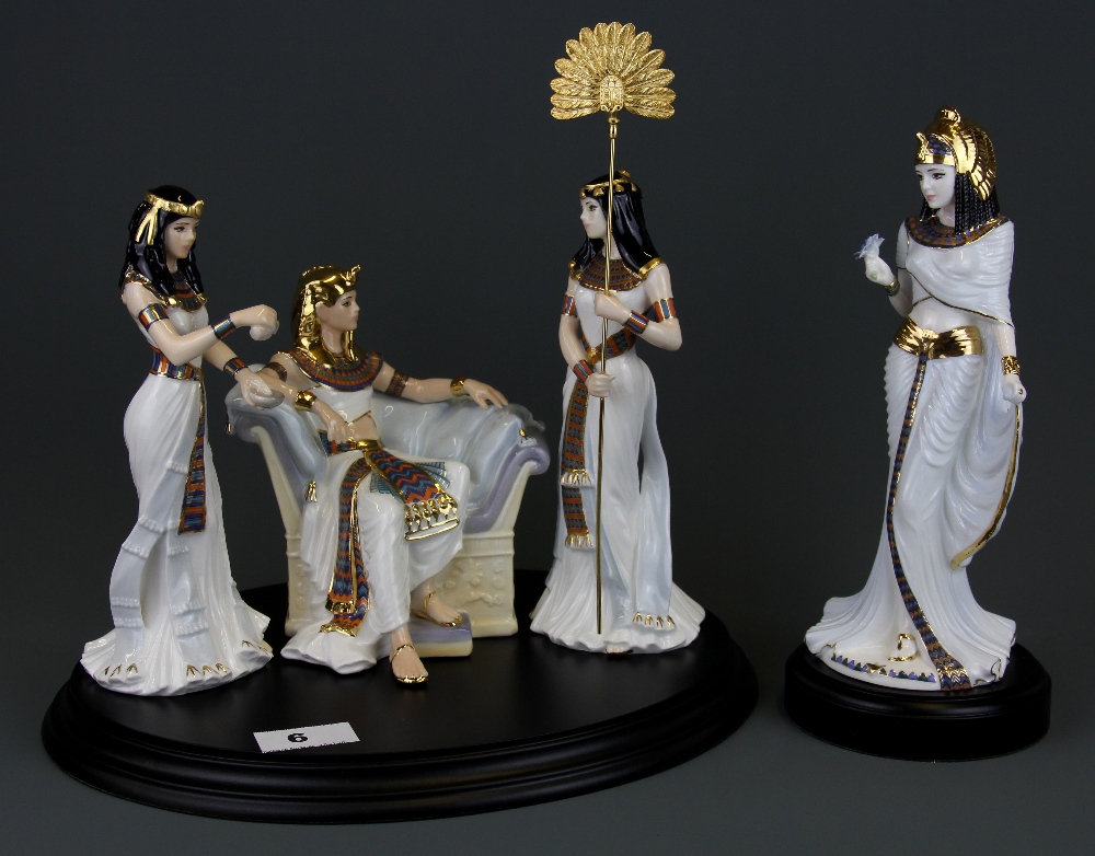 A group of Royal Worcester 'Court of Tutankhamun' limited edition (395/500) porcelain figures on a