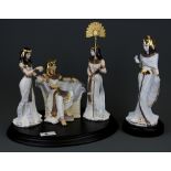 A group of Royal Worcester 'Court of Tutankhamun' limited edition (395/500) porcelain figures on a
