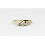 A 9ct yellow gold diamond set solitaire ring, (K.5).