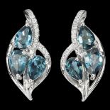 A pair of 925 silver earrings set with blue topaz and white stones, L. 2cm.