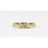 An 18ct yellow gold ring set with three brilliant cut diamonds, approx. 0.60ct, (O.5).