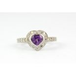 A 9ct white gold amethyst and diamond set heart shaped ring, (P).