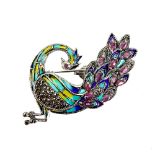 A peacock shaped 925 silver and marcasite enamelled brooch / pendant set with rubies, L. 6cm.