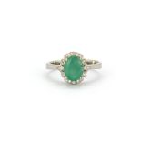 A 925 silver oval cut emerald and white stone set cluster ring, (P.5).
