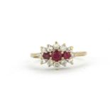 A 9ct yellow gold ruby and diamond set cluster ring, (M.5).