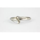 A 14ct white gold (stamped 585) diamond set ring, (T).