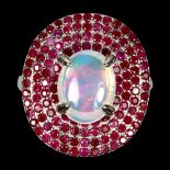 A 925 silver cluster ring set with a cabochon cut opal and two rows of rubies, (N).