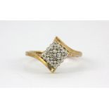 A 9ct yellow gold diamond set cluster ring, (M.5).