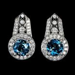 A pair of 925 silver earrings set with round cut London blue topaz and white stones, L. 2cm.
