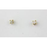 A pair of 9ct yellow gold diamond set stud earrings, approx. 0.30ct.