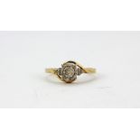 A 9ct yellow gold (stamped 9k) diamond set cluster ring with diamond set shoulders, (P).