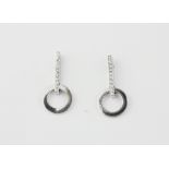 A pair of 18ct white gold diamond set drop earrings, L. 2.4cm.