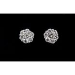 A pair of 18ct white gold diamond set cluster stud earrings, approx. 0.25ct overall, Dia. 0.4cm.