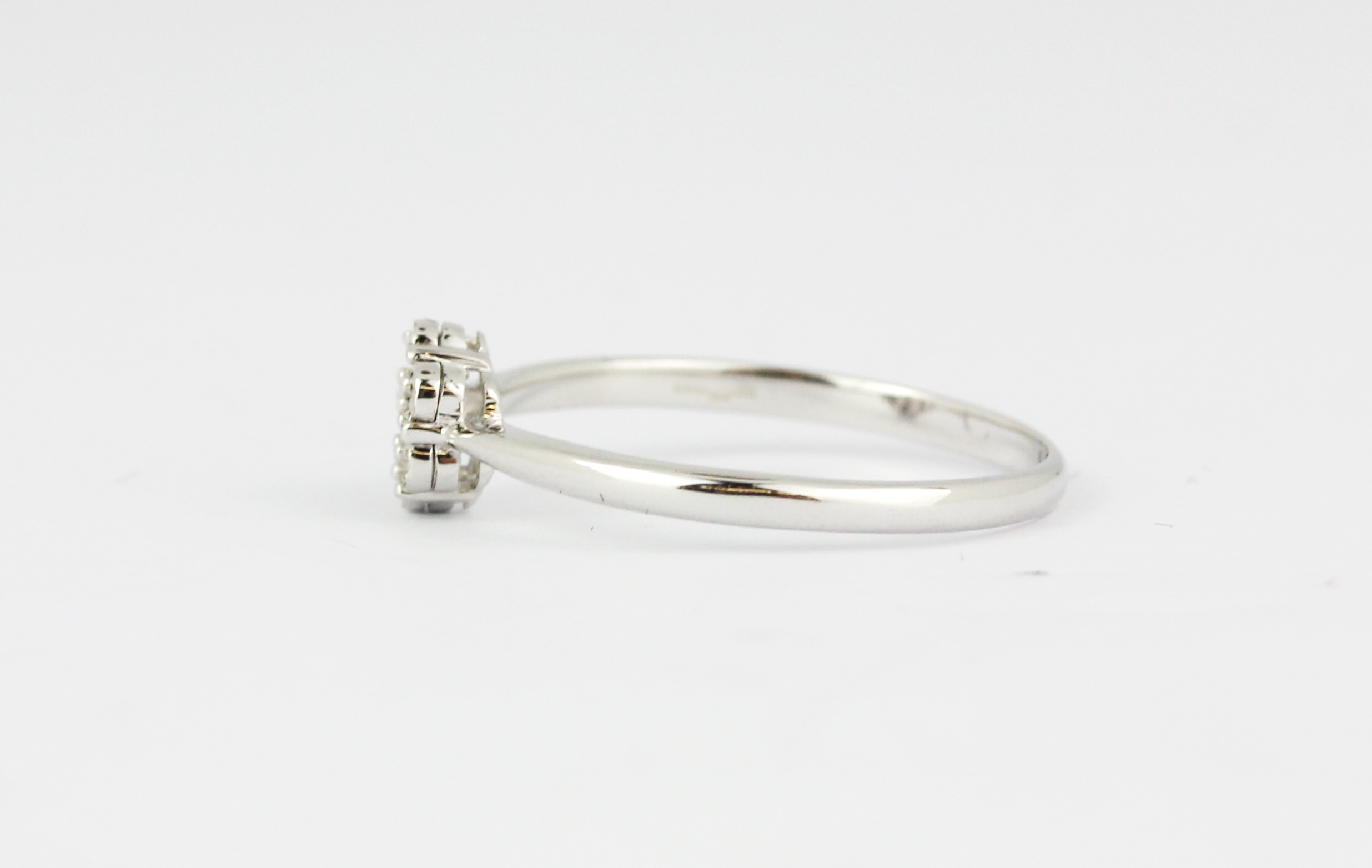 A 9ct white gold diamond set cluster ring, (M). - Image 2 of 2