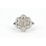 An 18ct white gold brilliant cut diamond set flower shaped cluster ring, approx. 1ct overall, (L.