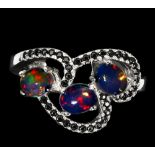 A matching 925 silver ring set with cabochon cut opals and black spinels, (L.5).