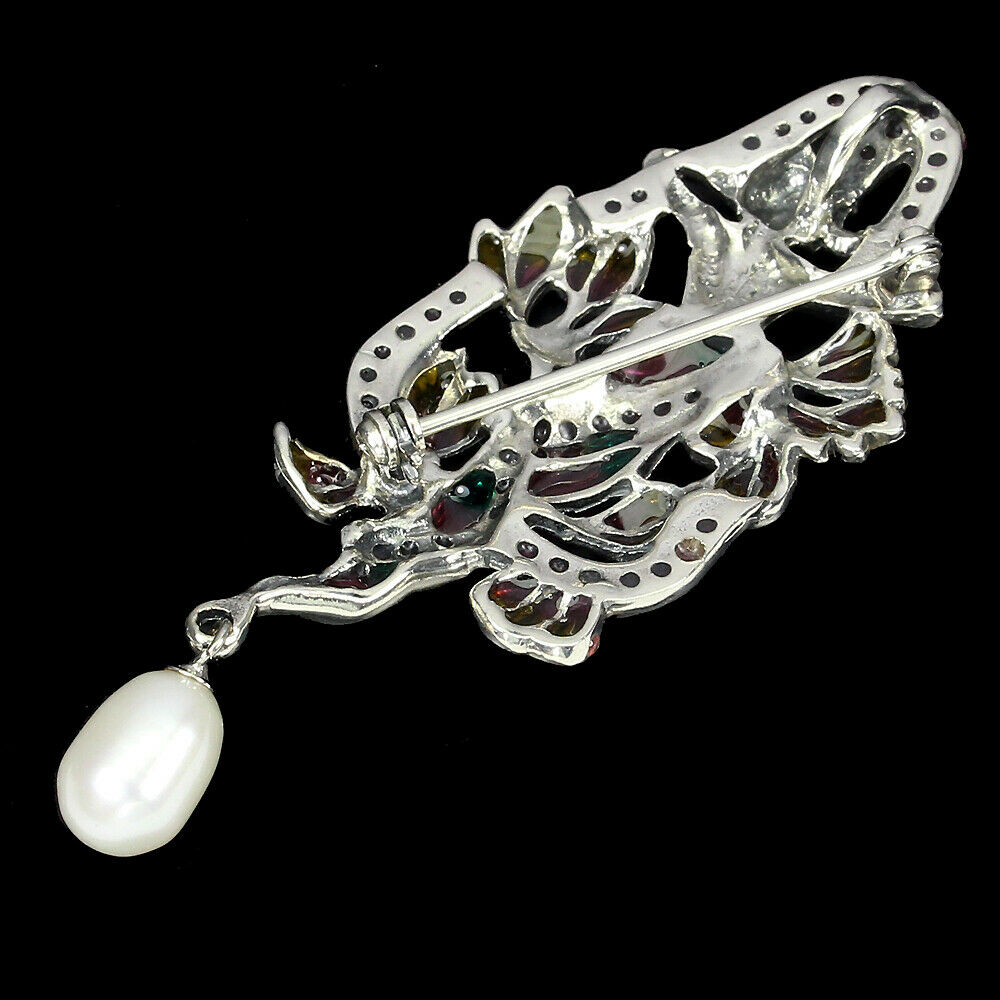 An Art Nouveau style 925 silver enamelled brooch / pendant set with rubies and a pearl, L. 6.5cm. - Image 2 of 2