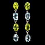 A pair of 925 silver drop earrings set with oval cut peridots and blue topaz, L. 3.5cm.