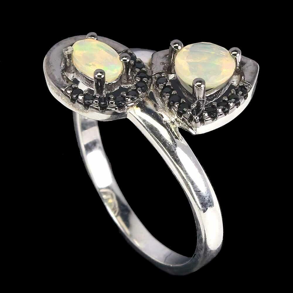 A 925 silver crossover ring set with opals and black spinels, (R). - Image 2 of 2