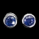 A pair of 925 silver stud earrings set with round cut sapphires, Dia. 0.6cm.