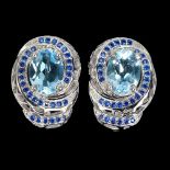 A pair of 925 silver earrings set with oval cut blue topaz and blue stones, L. 1.6cm.