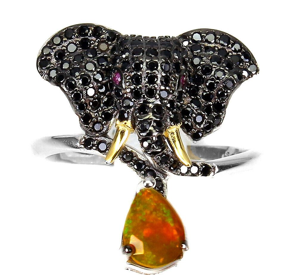 A 925 silver elephant shaped ring set with black spinels, opals and ruby set eyes, (N.5).