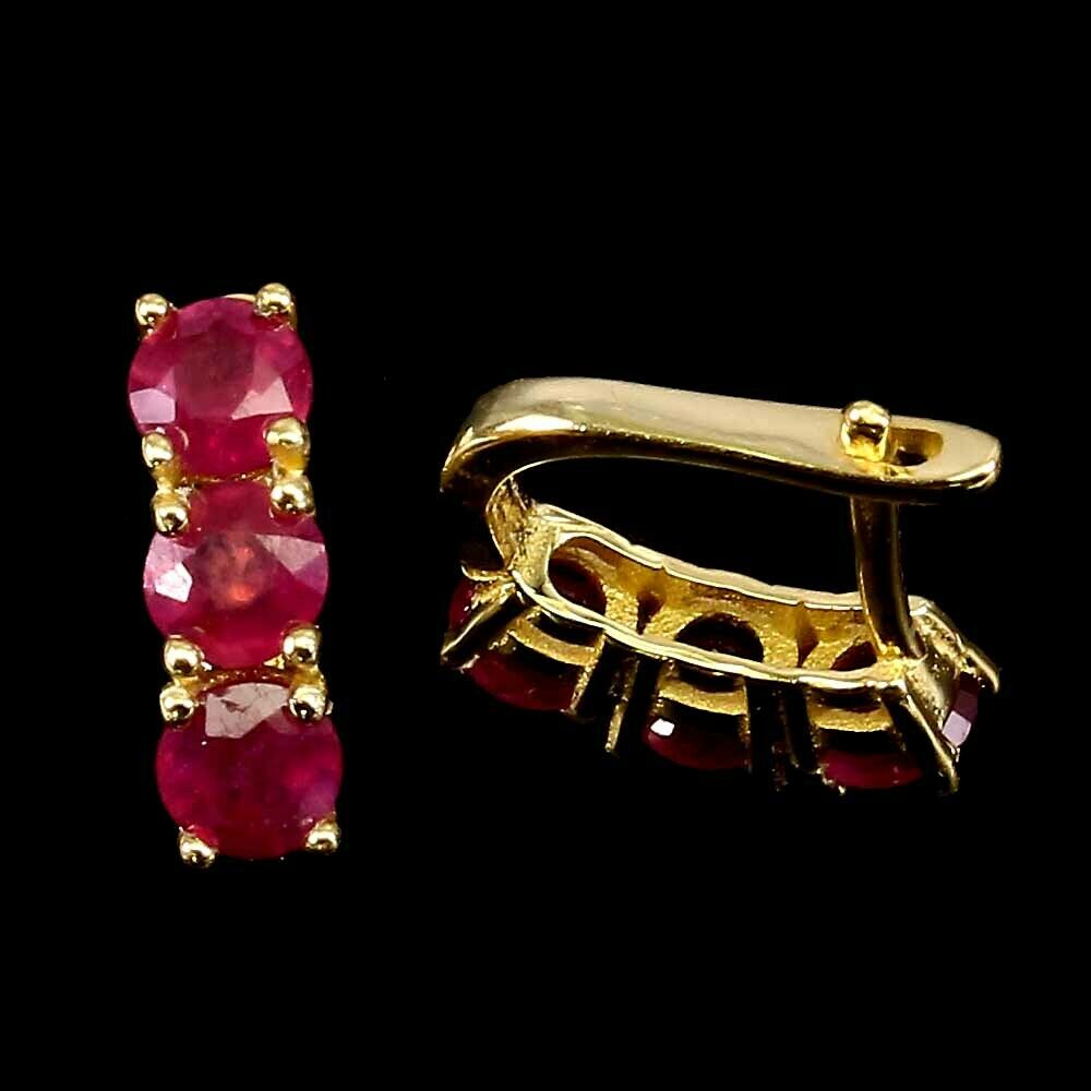 A pair of 925 silver gilt earrings set with round cut rubies, L. 1.1cm. - Image 2 of 2