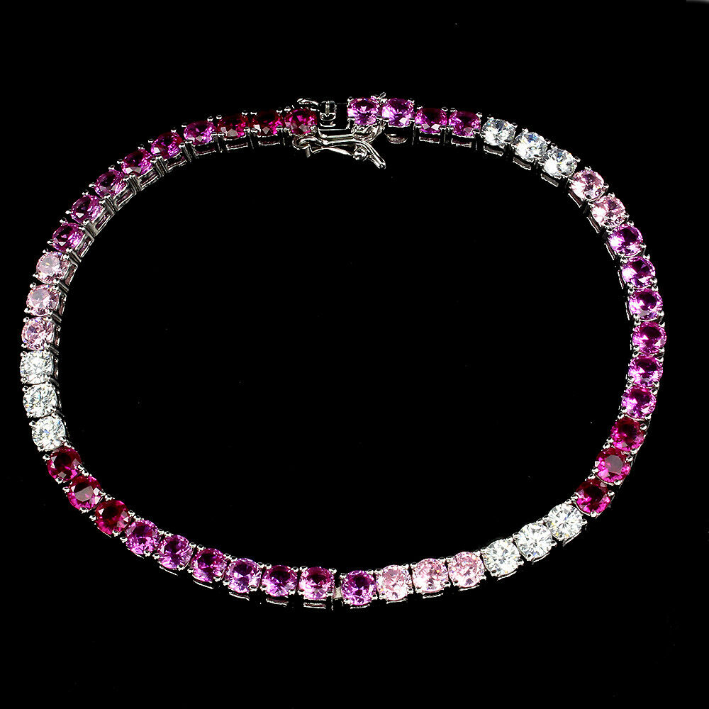 A 925 silver pink topaz and white stone set bracelet, L. 18cm.