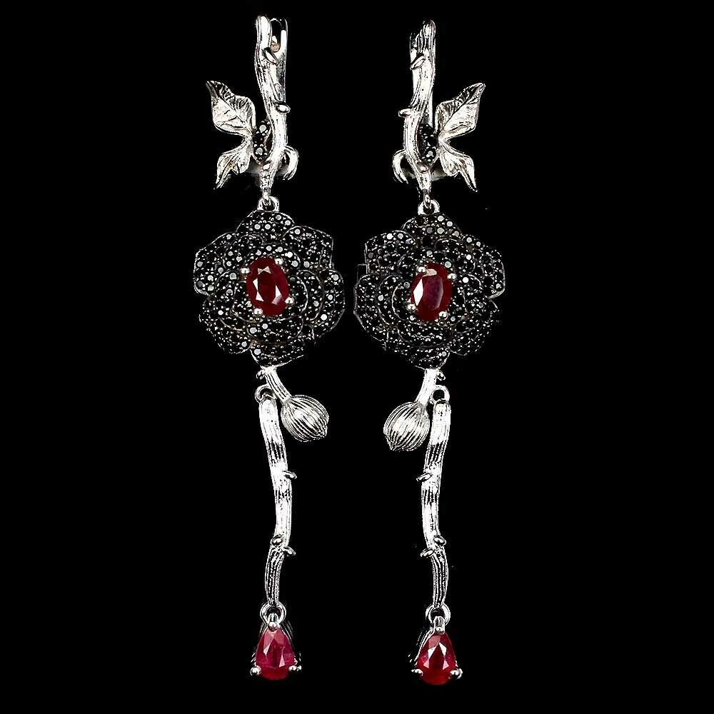 A pair of 925 silver drop earrings set with rubies and black spinels, L. 7cm.