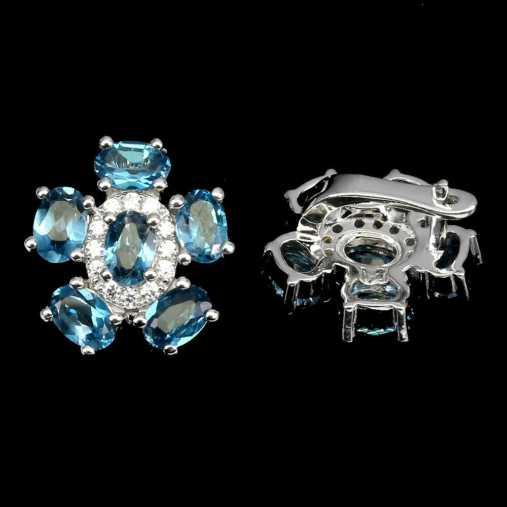 A pair of 925 silver flower shaped earrings set with London blue topaz and white stones, L. 1.8cm. - Image 2 of 2