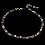 A 925 silver bracelet set with oval cut amethyst and peridots, L. 16cm.