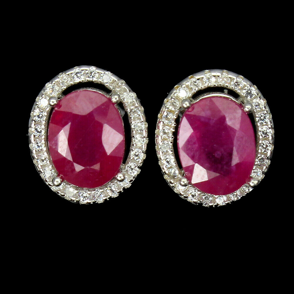 A pair of 925 silver oval cut ruby and white stone set cluster stud earrings, L. 1.1cm.