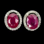 A pair of 925 silver oval cut ruby and white stone set cluster stud earrings, L. 1.1cm.